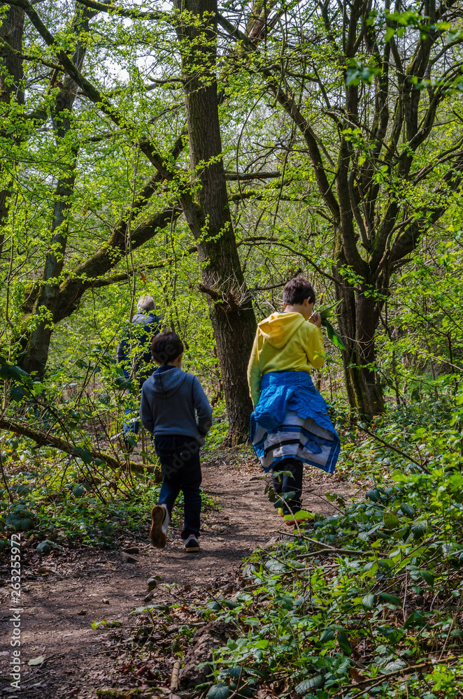 A family on a walk along country lanes at th evillage of Perton near Wolverhampton in South Staffordshire, UK A family on a walk along country lanes at th evillage of Perton near Wolverhampton in South Staffordshire, UK