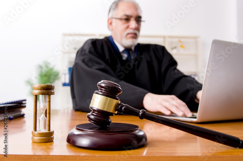 Aged lawyer working in the courthouse   photo