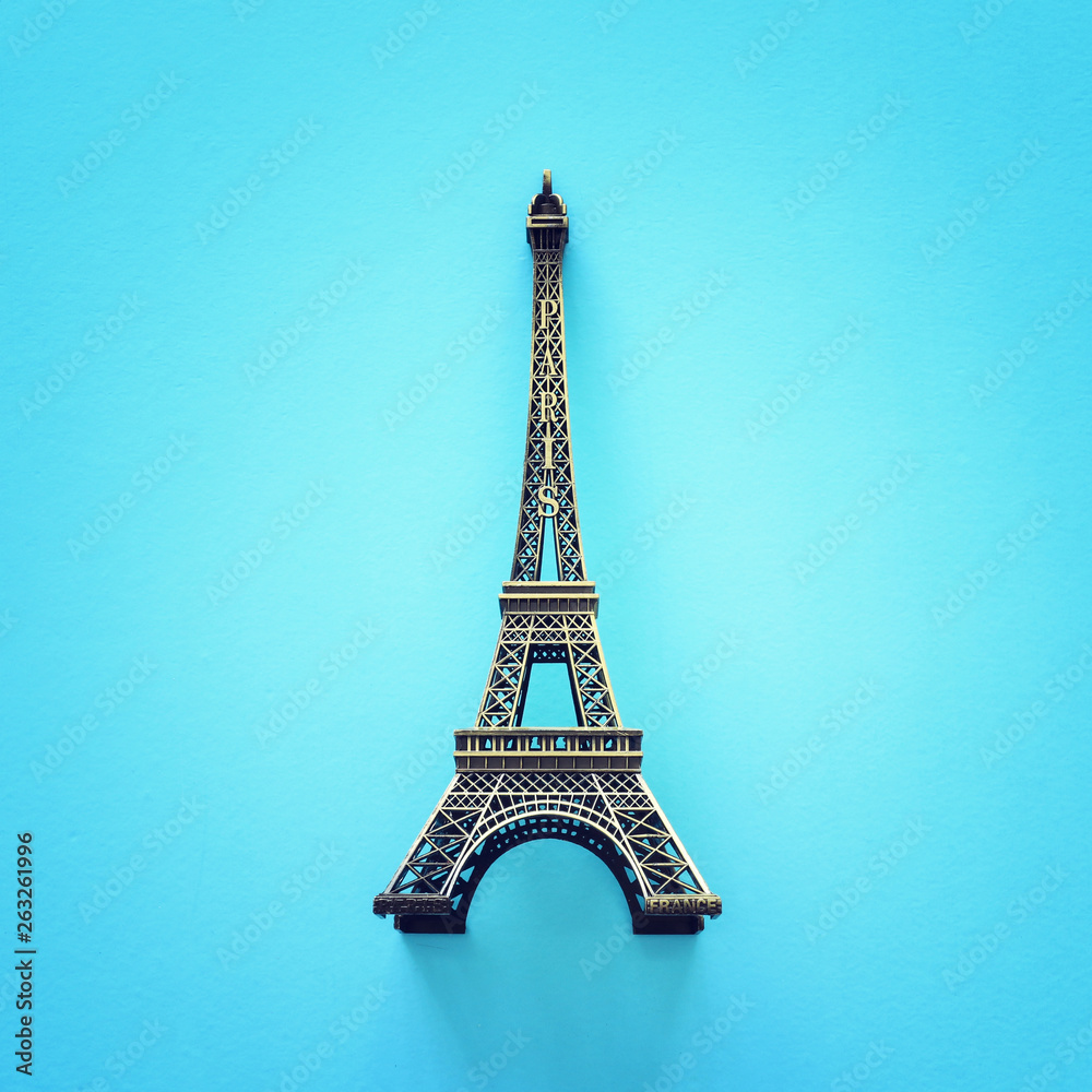 Paris symbol Eiffel Tower over blue background