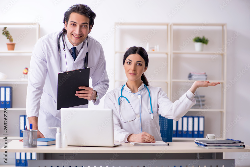Two young doctors working in the clinic Two young doctors working in the clinic