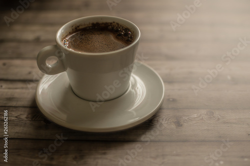 White coffee Cup on wood natural background