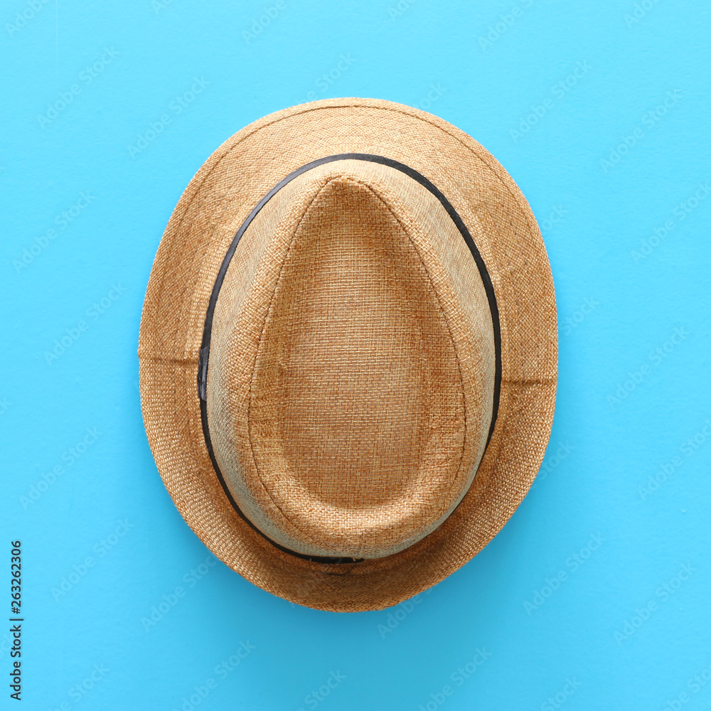 Top view of male fedora hat over blue background Stock Photo | Adobe Stock