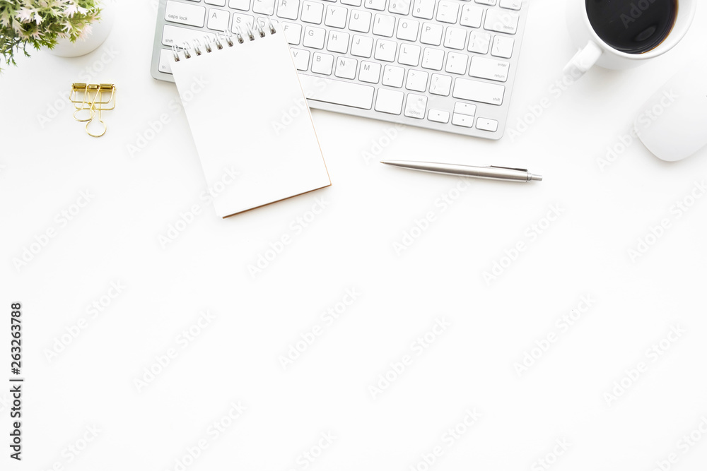 White minimal office desk table with computer keyboard, mouse and supplies. Top view with copy space, flat lay. White minimal office desk table with computer keyboard, mouse and supplies. Top view with copy space, flat lay.