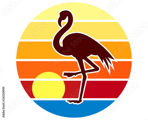 Back lit flamingo silhouette at sunset by lake