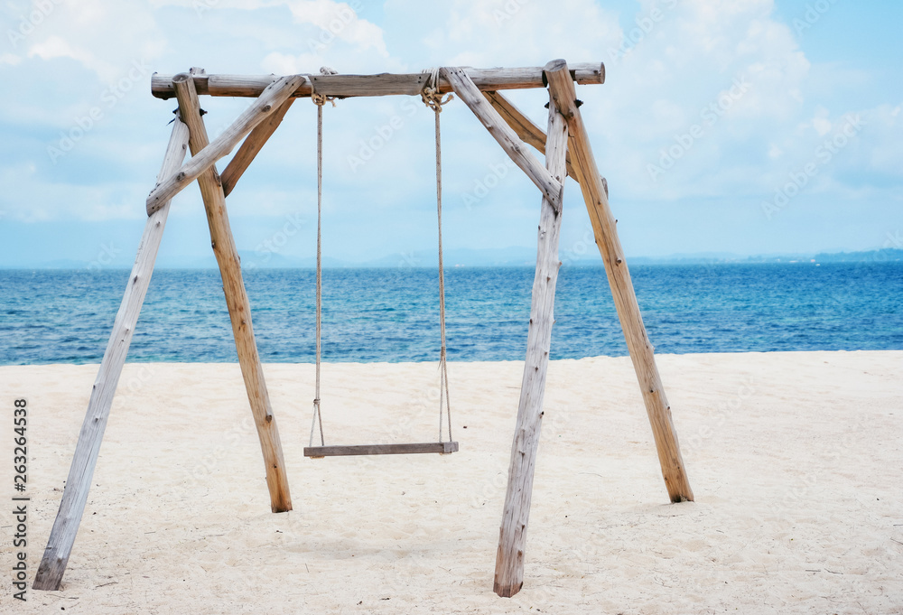 Wooden swing on the beach and Blue Ocean Sea Water Landscape Seascape.,copy space.,Thailand Wooden swing on the beach and Blue Ocean Sea Water Landscape Seascape.,copy space.,Thailand