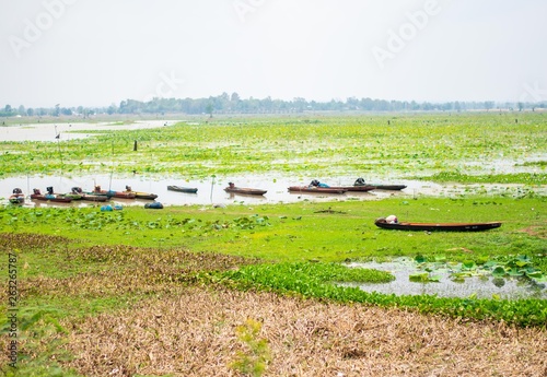 landscape view of river with fishing boat in thailand photo