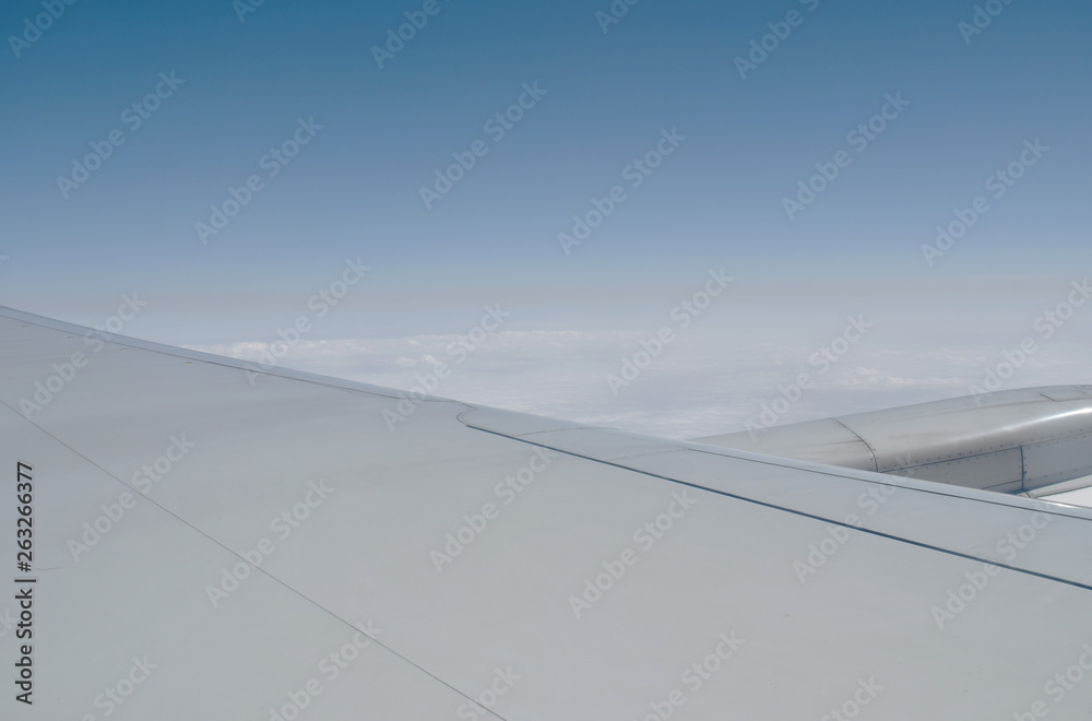 plane wing and cloud floating on sky through window frame plane wing and cloud floating on sky through window frame