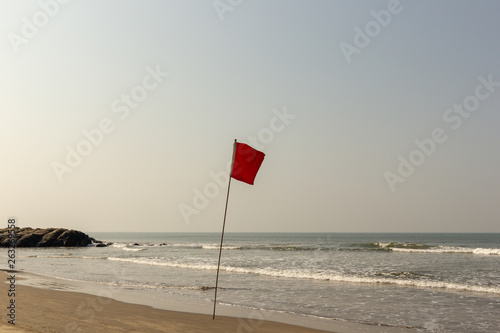 Red flag on the ocean. Warning red flag