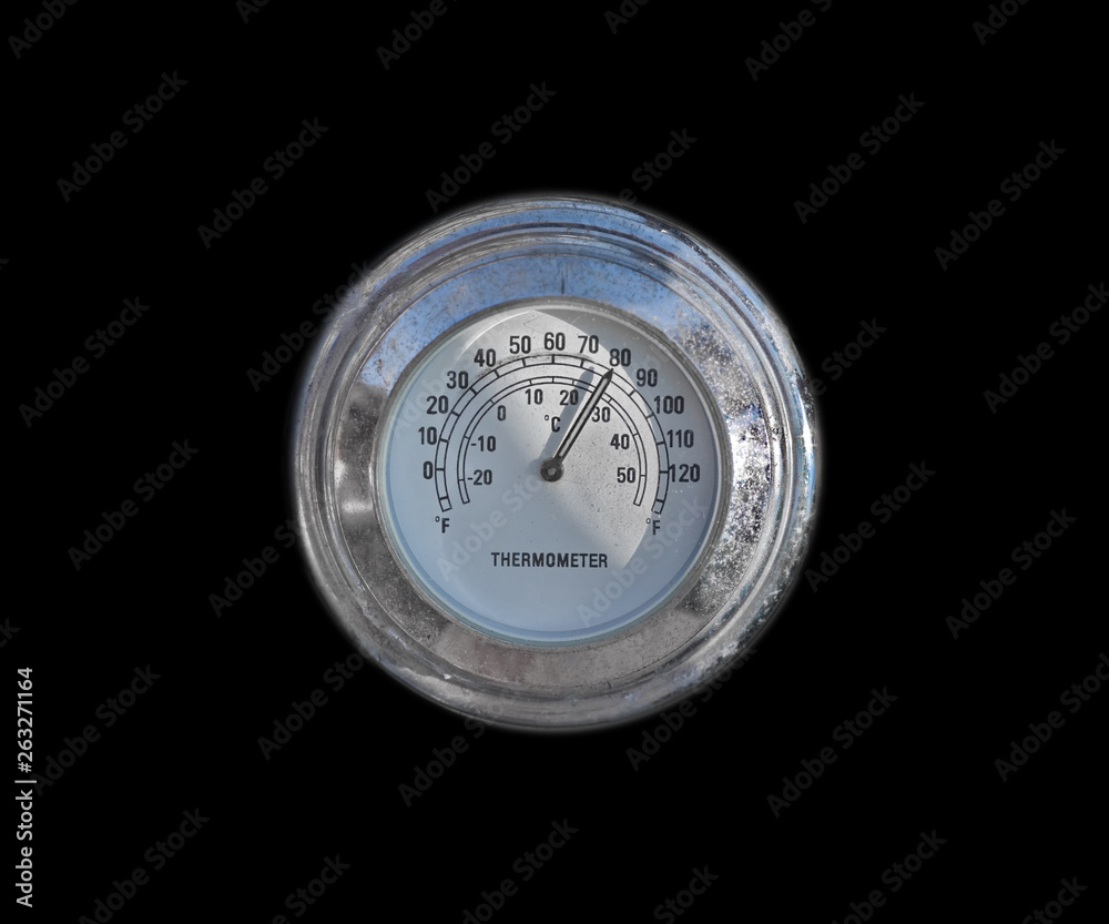 Old circular chrome thermometer on the black background isolated Old circular chrome thermometer on the black background isolated