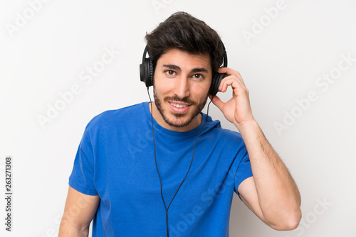 Handsome man listening to music with headphones