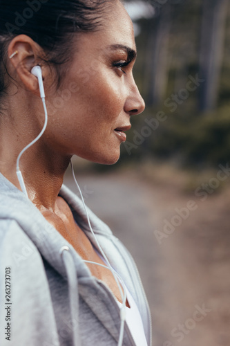 Wallpaper Mural Female runner with earphones Torontodigital.ca