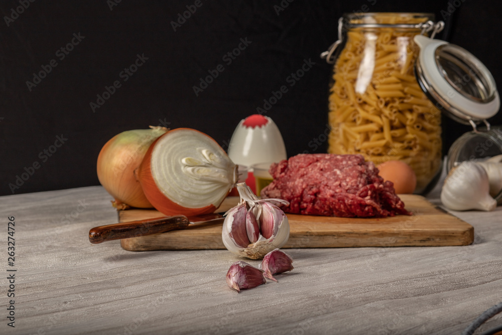 still life of minced meat, preparation of macaroni bolognese