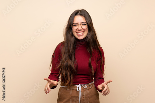 Teenager girl with glasses smiling