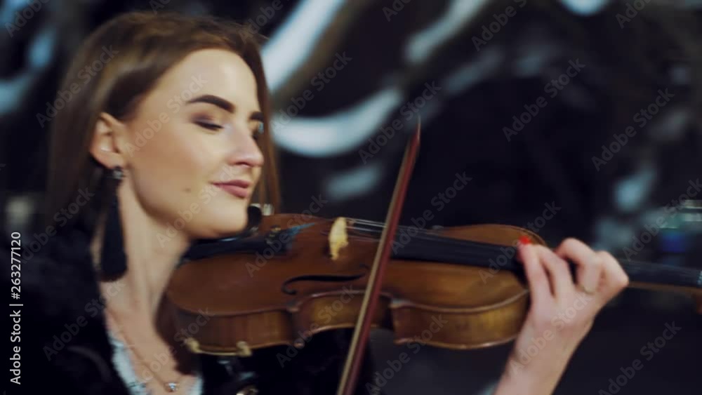 Playing violin instrument in the winter time Playing violin instrument in the winter time