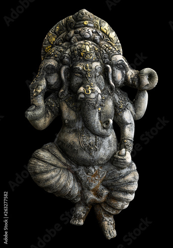 Ancient Ganesha statue isolated on black background with clipping path