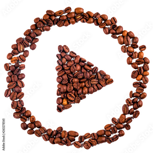 Isolated play command made of coffee beans. Illustrating concept of coffee as pause/play button in life.