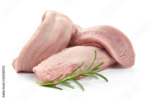 Raw pork tongue with rosemary, close-up, isolated on white background photo