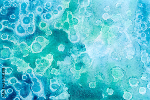 Abstract bright watercolor background. Turquoise stains and drops. Hand Drawn Texture