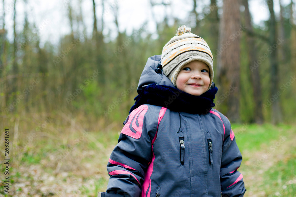 little girl walking in the cold spring forest is pretty smiling little girl walking in the cold spring forest is pretty smiling