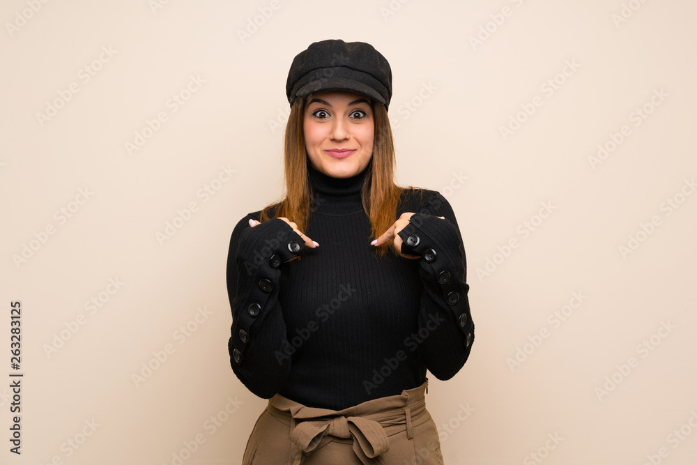 Fashion woman with hat with surprise facial expression