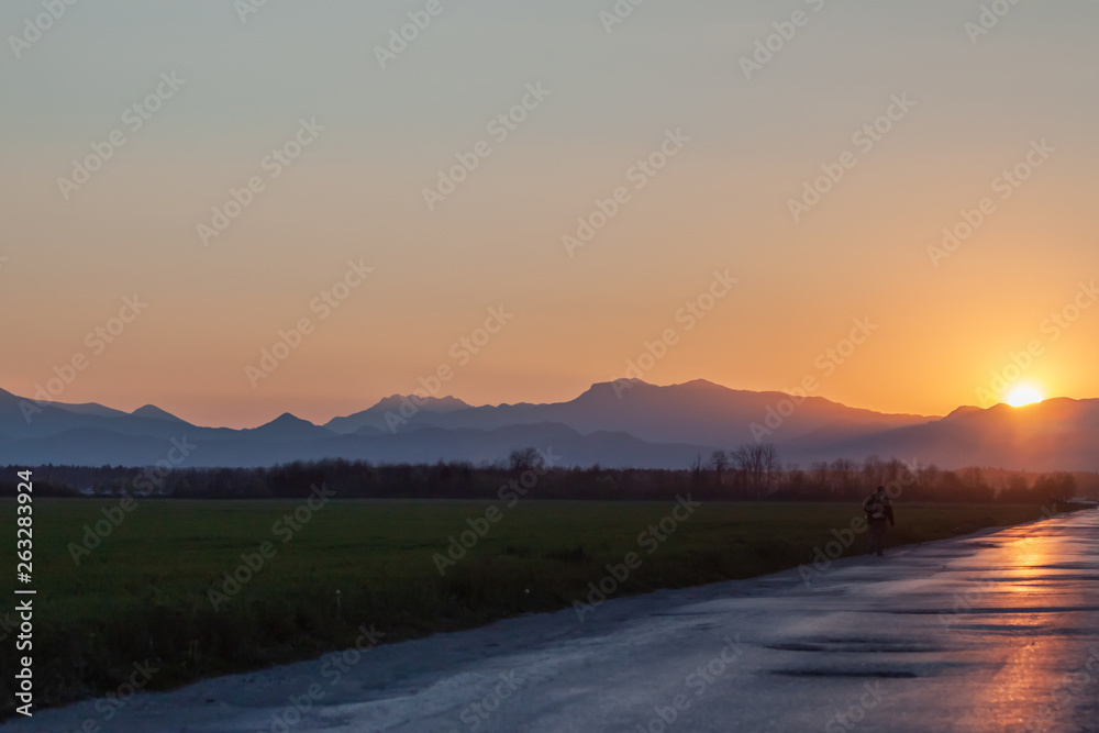 evening road heading to beautiful sunset horizon