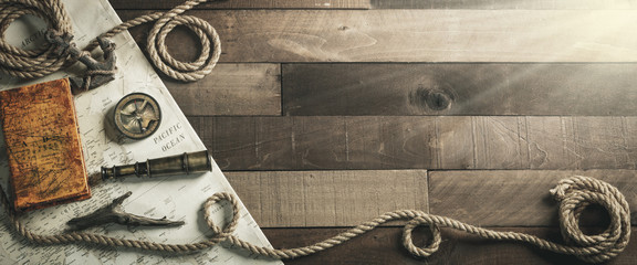 Vintage Nautical Travel Instruments With Rope And Anchor On Wooden Ship Deck Background - Travel / Leadership Concept 