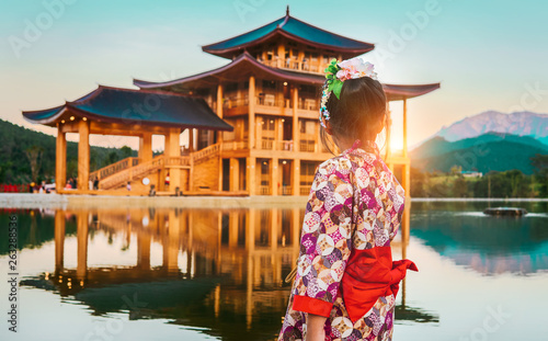 little asian girl wearing Japanese Kimono at the Golden Pavilion