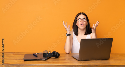 Business woman in a office frustrated by a bad situation