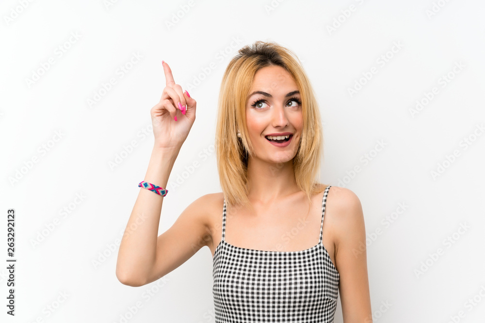 Young blonde woman over isolated white intending to realizes the solution while lifting a finger up Young blonde woman over isolated white intending to realizes the solution while lifting a finger up