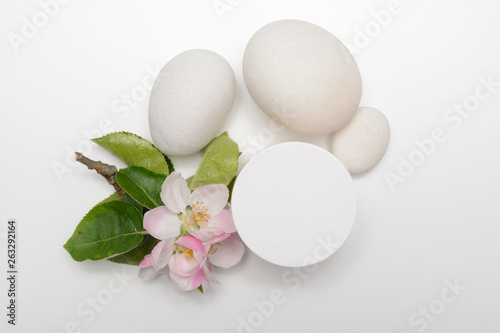 Beauty product container with blossom and nature theme