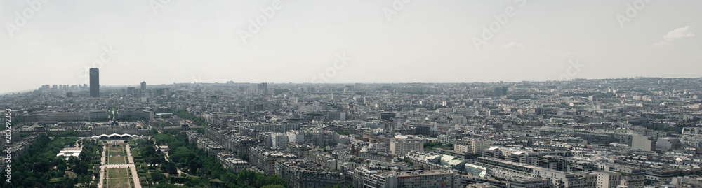 A panoramic view of the beautiful city of Paris, France, but a huge portion of the picture is about crowded urban districts that are not an ideal place for living.