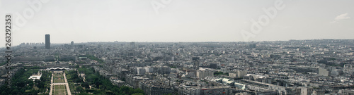 A panoramic view of the beautiful city of Paris, France, but a huge portion of the picture is about crowded urban districts that are not an ideal place for living.