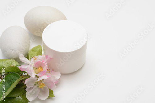 Beauty product container with blossom and nature theme
