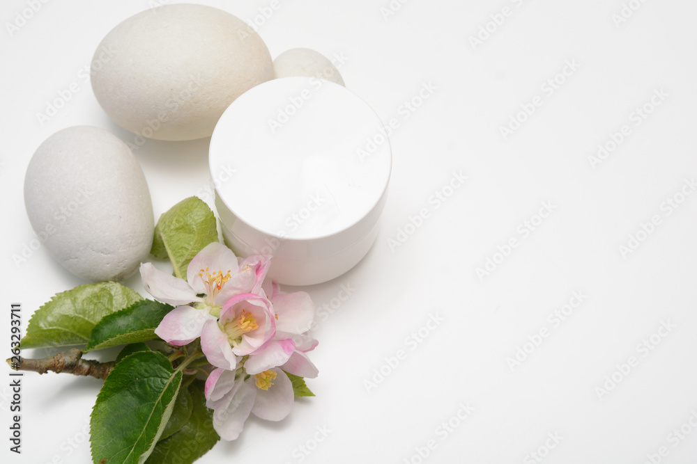 Beauty product container with blossom and nature theme Beauty product container with blossom and nature theme