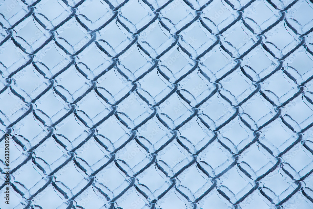 Fototapeta premium Abstract background with ice on metal fence
