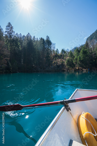 A boat on Blue lake, Blausee, in Bernese Oberland, Switzerland © Buebelina