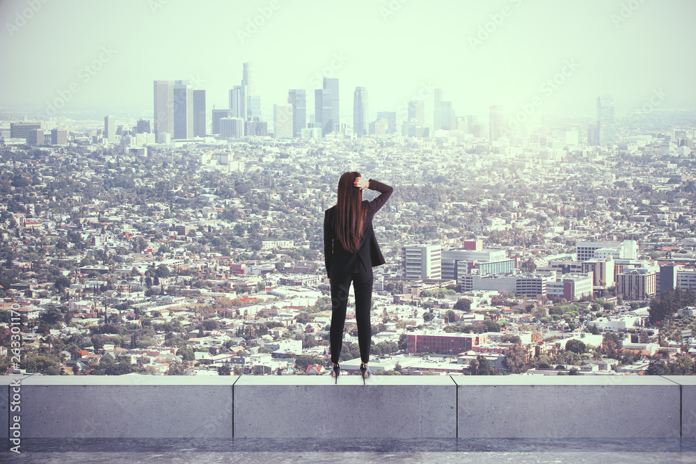 Backview of woman on rooftop Backview of woman on rooftop