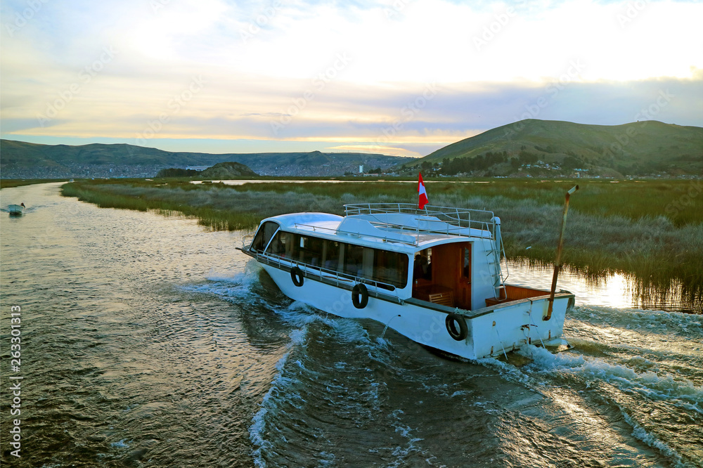 Naklejka premium Cruise Boat on Lake Titicaca, the Highest Navigable Lake in the World, Puno, Peru