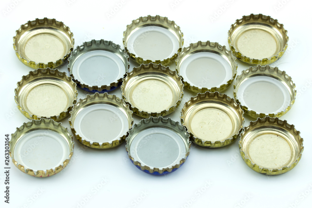 Metal cover from glass bottles. Decorative beer caps on white background. Metal cover from glass bottles. Decorative beer caps on white background.