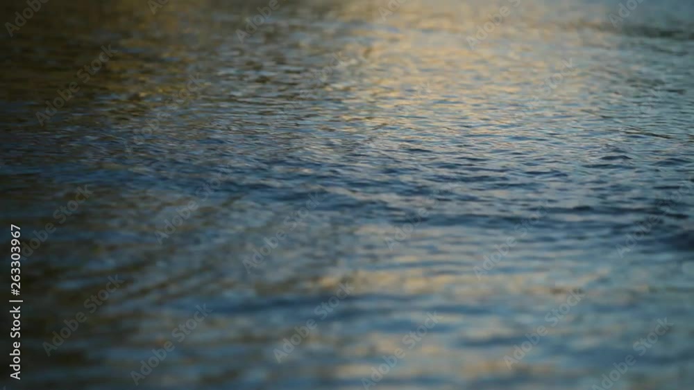 Water flows quickly on a flooded street. Water flows quickly on a flooded street.