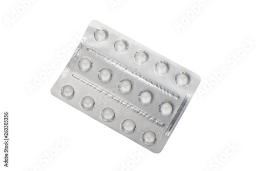 Medical pills in silver blister packs isolated on white background