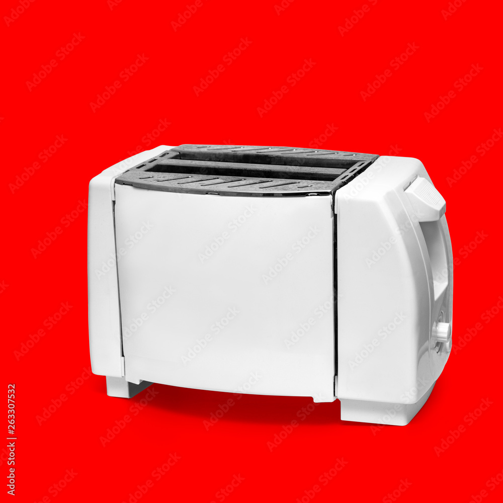 The image of toaster under the red background The image of toaster under the red background