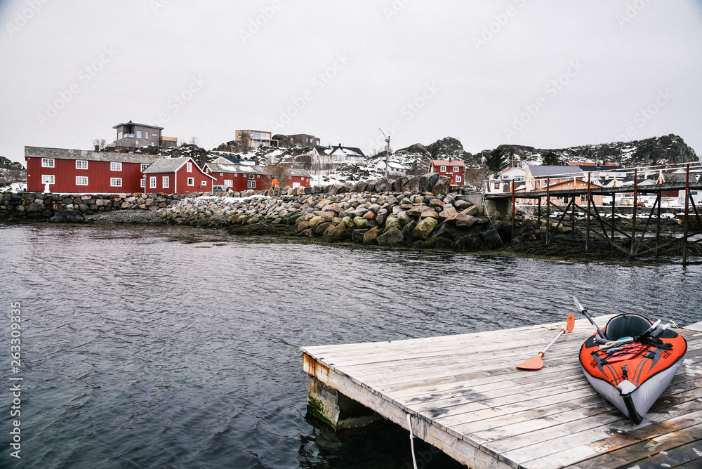 Winter Kayaking Along Coast of Lofoten Archipelago in the Arctic Circle in Norway