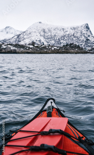 Winter Kayaking Along Coast of Lofoten Archipelago in the Arctic Circle in Norway