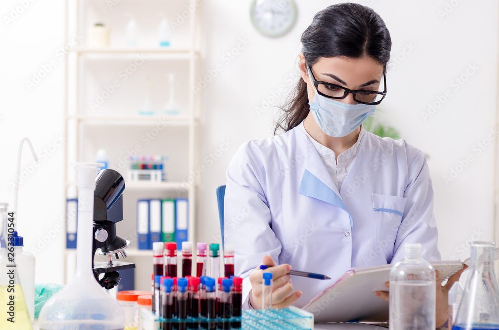 Young female chemist working in the lab Young female chemist working in the lab