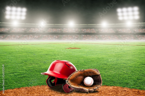 Baseball Glove, Ball, and Helmet on Field in Outdoor Stadium With Copy Space
