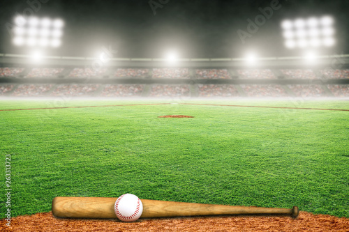 Baseball Bat and Ball on Field in Outdoor Stadium With Copy Space