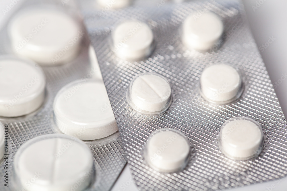 packing of white tablets, Packs of white pills packed in blisters packing of white tablets, Packs of white pills packed in blisters
