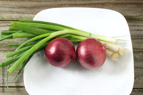 Red onion with green onion isolated
