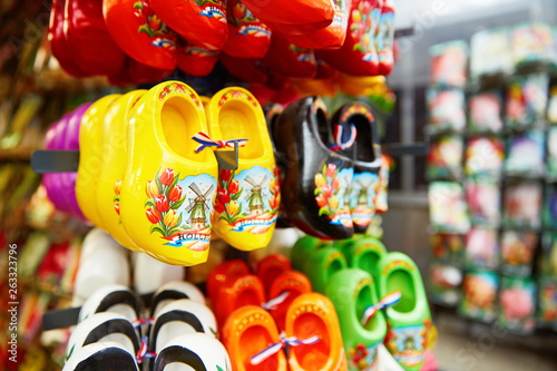 Mini ceramic wooden shoes as traditional footware from Holland for sale in a souvenir shop in Amsterdam, Holland